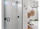 Bathroom featuring frameless glass shower doors, floating tub and modern chandelier at 21432 N 77Th Pl, Scottsdale, AZ 85255