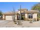 Beautiful home with desert landscaping, a three-car garage, and a tile roof at 21432 N 77Th Pl, Scottsdale, AZ 85255