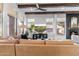 Living room featuring wood beams, natural light, and a contemporary fireplace at 21432 N 77Th Pl, Scottsdale, AZ 85255