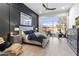 Modern main bedroom with backyard view, dark accent wall, and access to outdoor amenities at 21432 N 77Th Pl, Scottsdale, AZ 85255