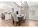 Open dining area with modern lighting and seamless kitchen access at 217 W Montecito Ave, Phoenix, AZ 85013