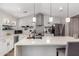 Bright kitchen featuring white cabinets, an island, and stainless steel appliances at 217 W Montecito Ave, Phoenix, AZ 85013