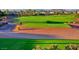 Scenic view of the Corte Bella golf course, featuring manicured greens, sand traps, and mountain views at 23034 N Pedregosa Dr, Sun City West, AZ 85375