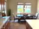 Spacious kitchen with wood cabinets, marble countertops, and a formal dining area at 23034 N Pedregosa Dr, Sun City West, AZ 85375