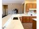 Kitchen with marble countertop island and sink, plus an adjacent living area at 23034 N Pedregosa Dr, Sun City West, AZ 85375