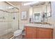 Bright bathroom offers tiled walk-in shower with glass door at 23034 N Pedregosa N Dr, Sun City West, AZ 85375