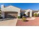 Charming single-story home with a well-manicured yard and a two-car garage at 23034 N Pedregosa Dr, Sun City West, AZ 85375