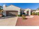 Charming single-story home with a well-manicured yard and a two-car garage at 23034 N Pedregosa N Dr, Sun City West, AZ 85375