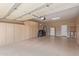 Garage with epoxy flooring and built-in storage cabinets at 23034 N Pedregosa Dr, Sun City West, AZ 85375