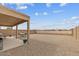 Spacious backyard featuring a covered patio and dining furniture at 24108 N Nectar Ave, Florence, AZ 85132