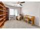 Bedroom features built-in bookshelves, and a quaint desk area at 24108 N Nectar Ave, Florence, AZ 85132