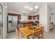 Bright dining area with stainless steel appliances and a view to the living room at 24108 N Nectar Ave, Florence, AZ 85132