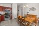 Elegant dining area with stylish lighting fixtures and a view of the kitchen at 24108 N Nectar Ave, Florence, AZ 85132