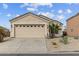 Charming single-story home with a large garage, desert landscaping, and a well-maintained front yard at 24108 N Nectar Ave, Florence, AZ 85132