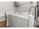 Convenient laundry room with a washer, dryer and shelving for storage at 24108 N Nectar Ave, Florence, AZ 85132