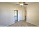 Bedroom features neutral paint and carpet, ceiling fan, and closet at 2541 S Sunnyvale Ave, Gilbert, AZ 85295