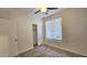 Bedroom features neutral paint and carpet, ceiling fan, closet, and a window with horizontal blinds at 2541 S Sunnyvale Ave, Gilbert, AZ 85295