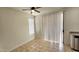 Bright dining area with neutral paint, large window with blinds, and a ceiling fan at 2541 S Sunnyvale Ave, Gilbert, AZ 85295