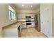 An updated kitchen features stainless steel appliances and light gray cabinets at 2541 S Sunnyvale Ave, Gilbert, AZ 85295