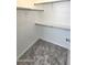 The walk-in closet is carpeted and has built in shelving and bars at 2541 S Sunnyvale Ave, Gilbert, AZ 85295