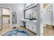 Elegant bathroom showcasing a large vanity with vessel sink and a walk-in closet, offering a spa-like ambiance at 2571 E Balsam Ct, Chandler, AZ 85286