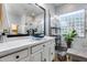 Bright bathroom with modern fixtures, stylish vanity, and a glass block window over a walk-in shower at 2571 E Balsam Ct, Chandler, AZ 85286