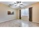 Neutral bedroom featuring a ceiling fan, tile floors and large window at 2571 E Balsam Ct, Chandler, AZ 85286