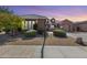 Charming single-story home featuring desert landscaping, a covered porch, and a two-car garage at 2571 E Balsam Ct, Chandler, AZ 85286