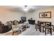 Inviting living room features modern furniture, light-colored floors, and a cozy atmosphere at 2571 E Balsam Ct, Chandler, AZ 85286