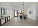 Bright dining room featuring a modern table, stylish lighting, and large windows with desert views at 2642 N Fiesta St, Scottsdale, AZ 85257