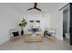 Bright living room with stylish decor, including woven furniture, neutral color palette, and decorative artwork at 2642 N Fiesta St, Scottsdale, AZ 85257