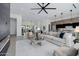 Open concept living room featuring a modern fireplace, large sectional, and open flow to the kitchen at 2642 N Fiesta St, Scottsdale, AZ 85257