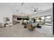 Open-concept living space featuring a large sofa, kitchen, and seamless indoor-outdoor flow to the pool at 2642 N Fiesta St, Scottsdale, AZ 85257