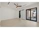 Spacious main bedroom with sliding barn door and access to outdoor space at 2642 N Fiesta St, Scottsdale, AZ 85257