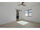 Bright main bedroom featuring a sliding barn door and modern ceiling fan at 2642 N Fiesta St, Scottsdale, AZ 85257