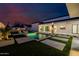 Stunning backyard pool with modern landscaping, outdoor kitchen, and seamless indoor-outdoor living spaces at 2642 N Fiesta St, Scottsdale, AZ 85257