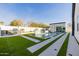 Stunning backyard view featuring an in-ground pool, barbecue area, and modern design at 2643 N Fiesta St, Scottsdale, AZ 85257