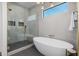 Modern bathroom features a soaking tub, glass shower, and stylish fixtures at 2643 N Fiesta St, Scottsdale, AZ 85257