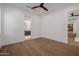 Bright bedroom with wood floors, ceiling fan, and ensuite bathroom at 2643 N Fiesta St, Scottsdale, AZ 85257