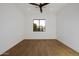 Bright bedroom featuring wood look tile flooring, a ceiling fan and a large window at 2643 N Fiesta St, Scottsdale, AZ 85257