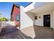 Modern carport featuring clean lines and a blend of textures with wood accents and concrete flooring at 2643 N Fiesta St, Scottsdale, AZ 85257