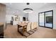 Dining area open to the kitchen, featuring stylish lighting and seamless access to outdoor spaces at 2643 N Fiesta St, Scottsdale, AZ 85257