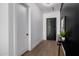 Modern hallway with a sleek black accent wall, and a stylish table with elegant decor at 2643 N Fiesta St, Scottsdale, AZ 85257