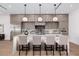 Well-lit kitchen featuring a large island with seating, modern appliances, and stylish cabinetry at 2643 N Fiesta St, Scottsdale, AZ 85257