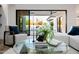 Detailed view of modern living room with glass table, pool view and elegant decor at 2643 N Fiesta St, Scottsdale, AZ 85257