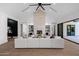 Stylish living room with a vaulted ceiling, fireplace, and views of the outdoor space at 2643 N Fiesta St, Scottsdale, AZ 85257