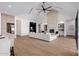 Bright living room featuring high ceilings, fireplace, and stylish white furniture with tile flooring at 2643 N Fiesta St, Scottsdale, AZ 85257