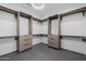 Well-organized walk-in closet with custom built-in shelves and drawers at 2643 N Fiesta St, Scottsdale, AZ 85257