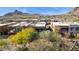 Aerial view of modern desert homes surrounded by trees and mountain views at 27000 N Alma School Pkwy # 2019, Scottsdale, AZ 85262