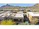 Modern desert home with a balcony and mountain views in an aerial photo at 27000 N Alma School Pkwy # 2019, Scottsdale, AZ 85262